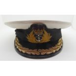 A Naval officer's cap with braid Condition Report: Available upon request