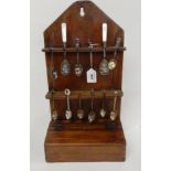 A wooden wall mounted spoon rack Condition Report: Available upon request