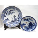 A large Japanese dish painted with mountainous landscape 40cm and another smaller dish 25cm