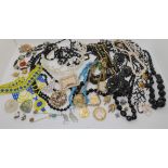 A collection of vintage costume jewellery to include beads, Earrings and a wedding tiara Condition