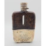 A hammered silver and animal skin hip flask, London 1892 of curved rectangular shape, 13.5cm high