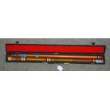A cased two-piece pool cue Condition Report: Available upon request
