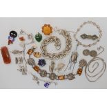 A collection of silver and costume jewellery items to include a silver charm bracelet etc