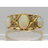 An 18ct gold opal and diamond chip ring, finger size O1/2, weight 4gms Condition Report: Available