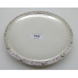 A silver dish, London 1941, of shallow circular form with a band of Celtic decoration on a