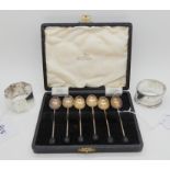 A lot comprising a cased set of six silver coffee bean spoons, Sheffield 1949 and two silver