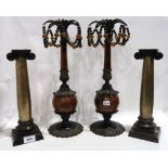 A pair of bronzed Ionic capital column candlesticks 32cm and a pair of patinated metal and bead