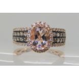 A 14k kunzite and diamond ring size M1/2, weight 4.4gms Condition Report: Available upon request
