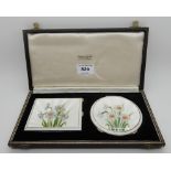 A cased silver and floral enamel compact and cigarette case set, Birmingham 1950, the cigarette case