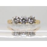 An 18ct gold three stone diamond ring set with estimated approx total of 0.50cts, finger size P,