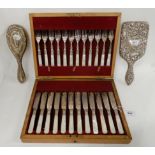 A lot comprising a cased twenty four piece EP and mother of pearl fish cutlery set, a silver