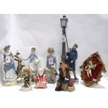 A collection of figures including Lladro Lamplighter, other Spanish figures, Royal Doulton Goody Two