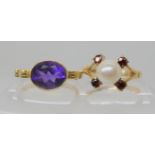 A 9ct gold 'friendship' ring engraved Amet amie and set with an amethyst size N and a 9ct gold