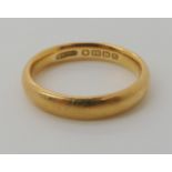 An 18ct gold court wedding ring, approximately size M1/2, (a little bent) weight 4.7gms Condition