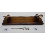 A lot comprising a silver letter opener with thistle shaped glass handle on oak stand, Glasgow 1954,