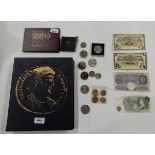A lot comprising an album of assorted coins including some pre' 47, a 1970 coin set, some