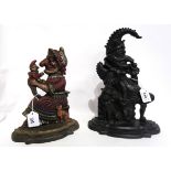 Two cast iron door stops modelled as Punch and Judy Condition Report: Available upon request
