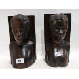 A pair of African hardwood figural bookends, 24cm high Condition Report: Available upon request