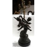 A large spelter cherub candelabra on raised circular marble base 84cm high Condition Report: in nice