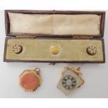 A boxed set of three yellow metal engraved and enamelled shirt studs, a 9ct gold mounted Masonic