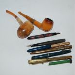 A small collection of vintage pens and two pipes etc Condition Report: Available upon request