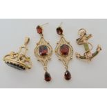 A pair of 9ct gold and garnet drop earrings, length 4.8cm, a yellow metal mounted Connemarra