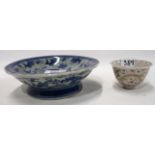 A small Chinese cracklure bowl decorated with a dragon, 7cm diameter together with a blue and