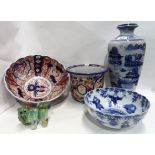 A large Imari bowl, an Imari jardiniere, a blue and white bowl decorated with figures, a blue and