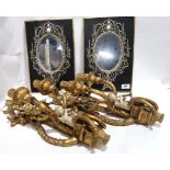 A pair of gilded resin wall sconces together with a pair of wall mirrors Condition Report: Available