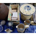 A set of three graduated pottery jugs and matching storage jar with sponge decoration, together with