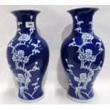 A pair of blue and white prunus decorated vases, 37cm high Condition Report: Available upon request