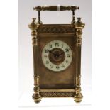 A French brass carriage clock with column supports and fretwork panels, 12cm high Condition