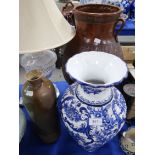 A tall studio pottery vase, a blue and white vase and a classical style vase Condition Report:
