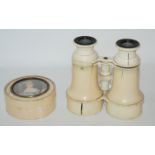 A pair of French ivory cased binoculars (def), 13cm high and a circular ivory box with pictorial