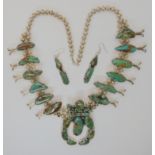 A silver and turquoise Navajo 'squash blossom' necklace with matching earrings, stamped BP made by