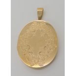 A large 9ct gold flower engraved locket dimensions including bail 6.5cm x 3.8cm, weight 32gms