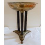 A silver plated bowl on three pillar stand on triptych base with paw feet, 46cm high x 35cm diameter