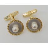 A pair of Mikimoto 14k gold mother of pearl, and pearl cufflinks, diameter 1.5cm, weight 7.1gms