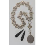A white metal Victorian locket and decorative chain together with a pair of carved jet drops