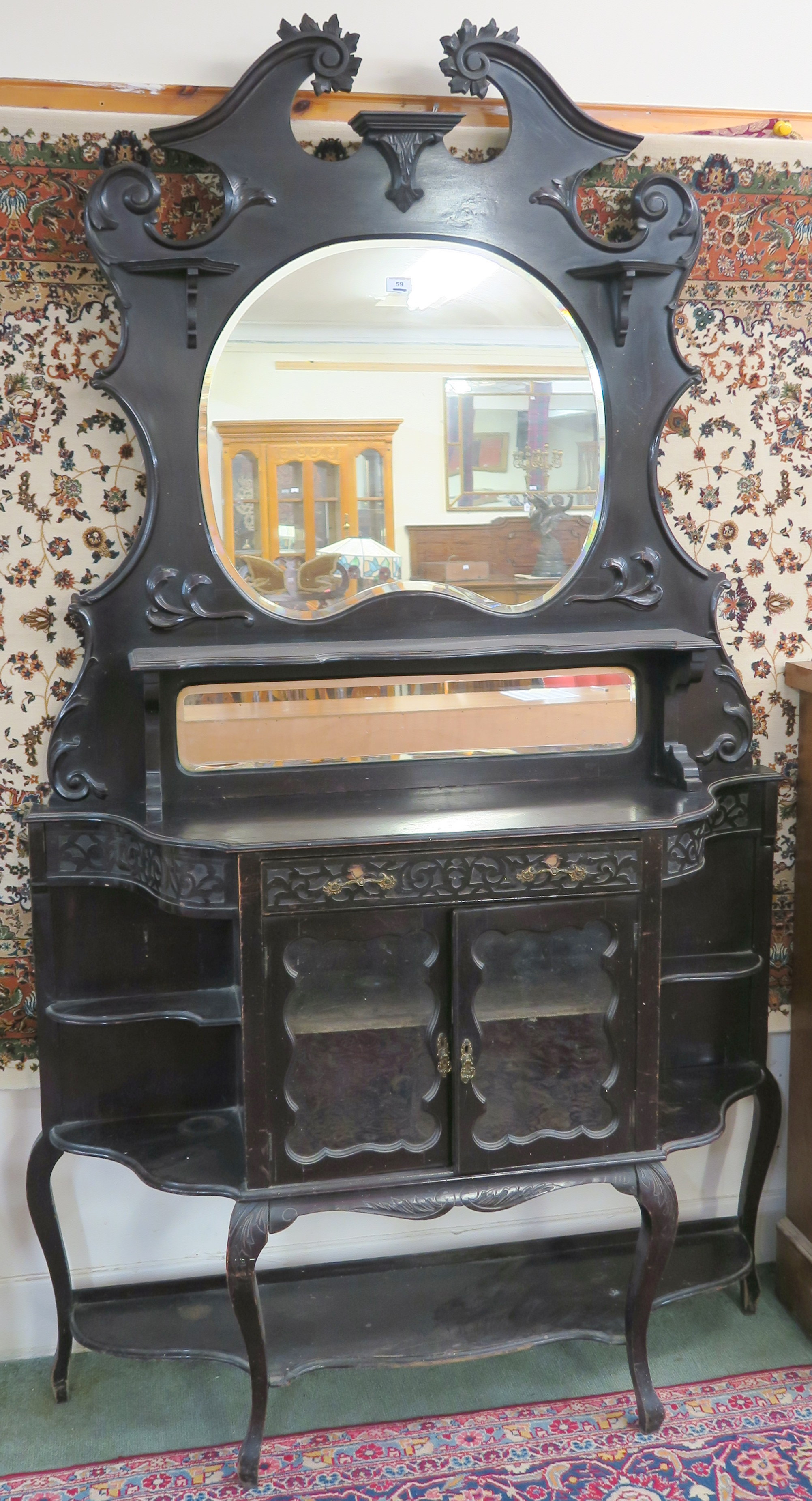 An ebonised sideboard with mirror back, 215cm high x 120cm wide x 33cm deep Condition Report: