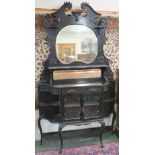 An ebonised sideboard with mirror back, 215cm high x 120cm wide x 33cm deep Condition Report: