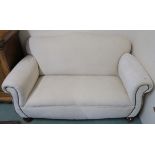 A cream upholstered two seater sofa, 85cm high x 150cm wide x 85cm deep Condition Report: