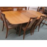 A G-plan teak extending dining table, 72cm high x 189cm wide x 99cm deep with six dining chairs (