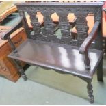 A stained oak hall bench with carved back and arms, 94cm high x 107cm wide x 40cm deep Condition
