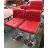 Four red vinyl bar stools by Ikayaa (4) Condition Report: Available upon request