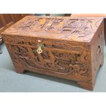 A heavily carved Chinese camphorwood chest, 59cm high x 101cm wide x 52cm deep Condition Report: