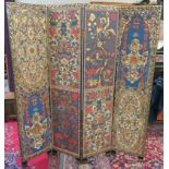 A decorative four fold screen, one side with stylised flowers and the other side with an ornate