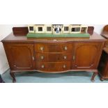 A mahogany sideboard with three drawers flanked by two doors, 119cm high x 182cm wide x 60cm deep