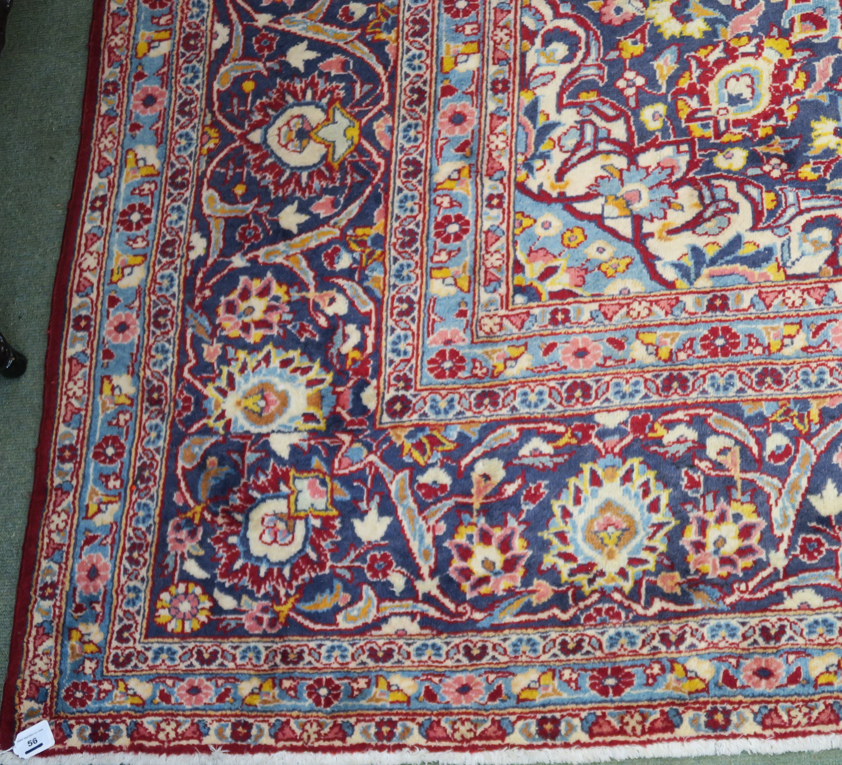 A large red ground Keshan rug with traditional design of blue central medallion, matching - Image 4 of 5