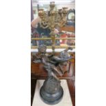 A large spelter cherub candelabra on raised circular marble base, 84cm high Condition Report: